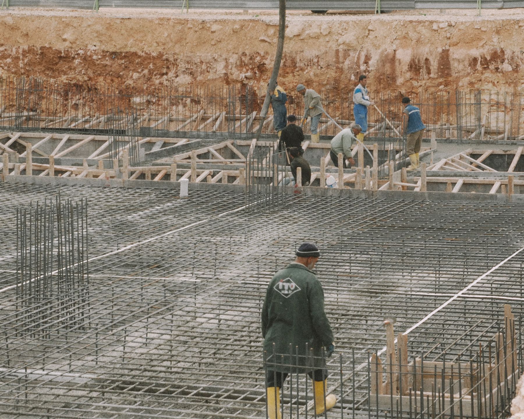 Commercial concrete slab with rebar grid being poured